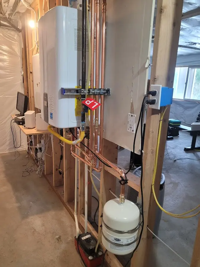 Licensed plumber repairing a kitchen sink in Decorah