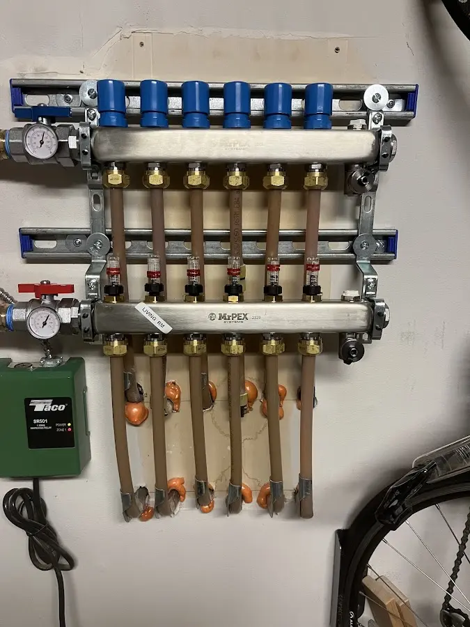 Plumber performing Gas Line Installation at a residential property in Decorah